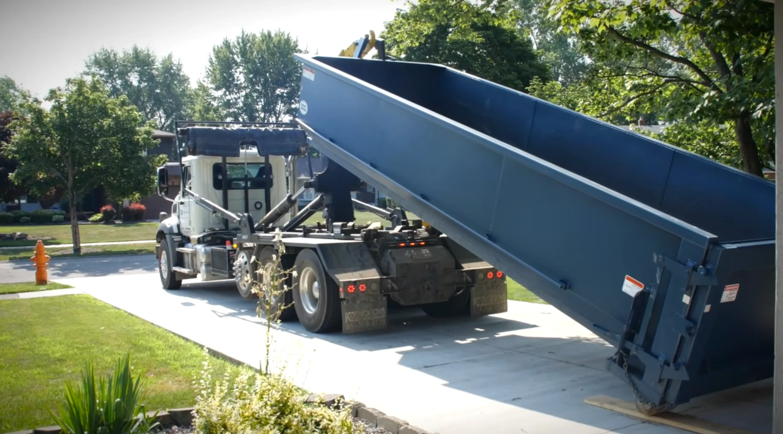 Roll off dumpster delivered to a residential driveway in Owensboro KY